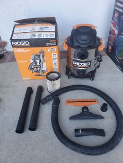 Shop RIDGID
10 Gal. 6.0 Peak HP Stainless Steel Shop Vacuum Wet Dry Vac with Filter, Locking Hose and Accessory Attachments WD1060