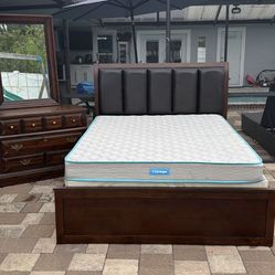Beautiful Queen size bed with 4 drawers added, mattress, boxspring, Dresser and mirror. Delivery available for an additional cost. 
