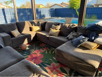 Grey sectional with pillows