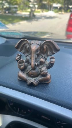 small bronze figurine of Lord Ganesha,