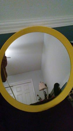 Very unique yellow metal mirror