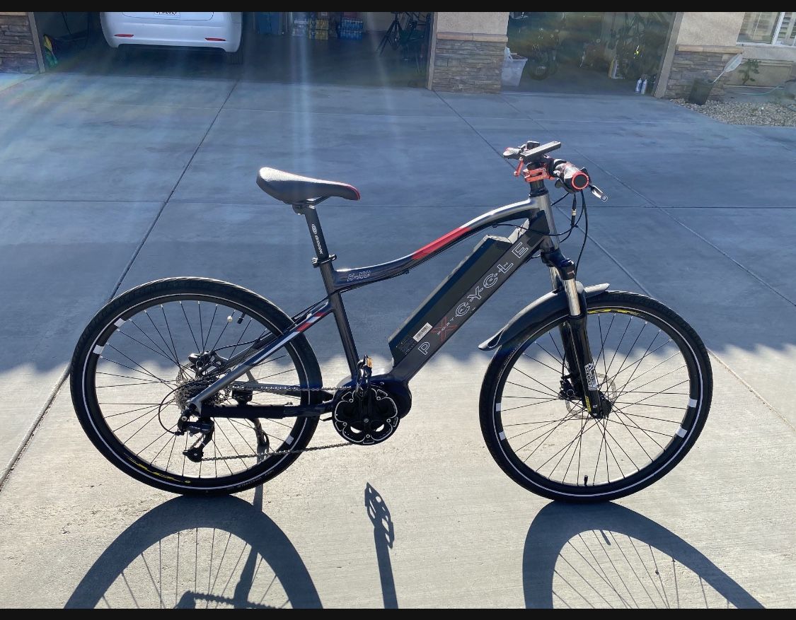 Mid Drive electric mountain bike with 2 sets of tires. One...