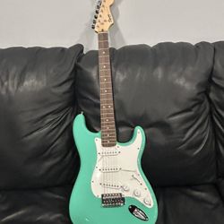 Squier Bullet® Stratocaster HT, Laurel Fingerboard, Tropical Turquoise With Strap And Tuner And Case And Amplifier Wire ( Not Shown ) 