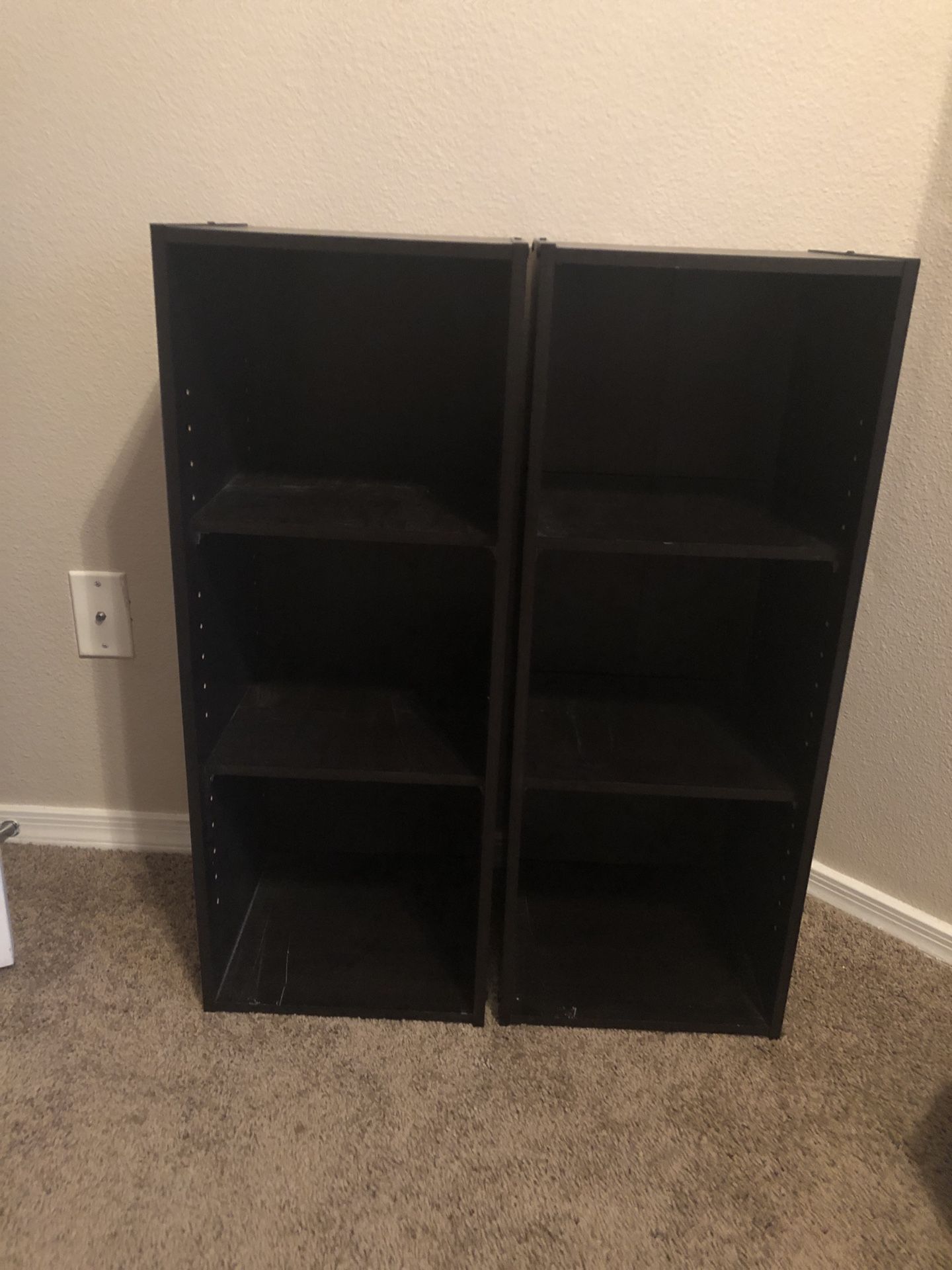Two black bookshelves