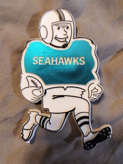Vintage Seattle Seahawks plastic pin back button, football player, 1980's
