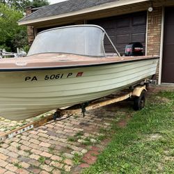16 Starcraft Fiberglass  Boat motor and trailer