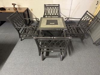 Nice patio set with propane fireplace in center.