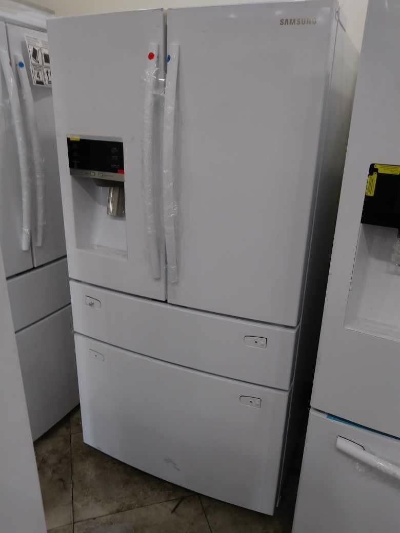 White Samsung four door French refrigerator home and kitchen. Appliances