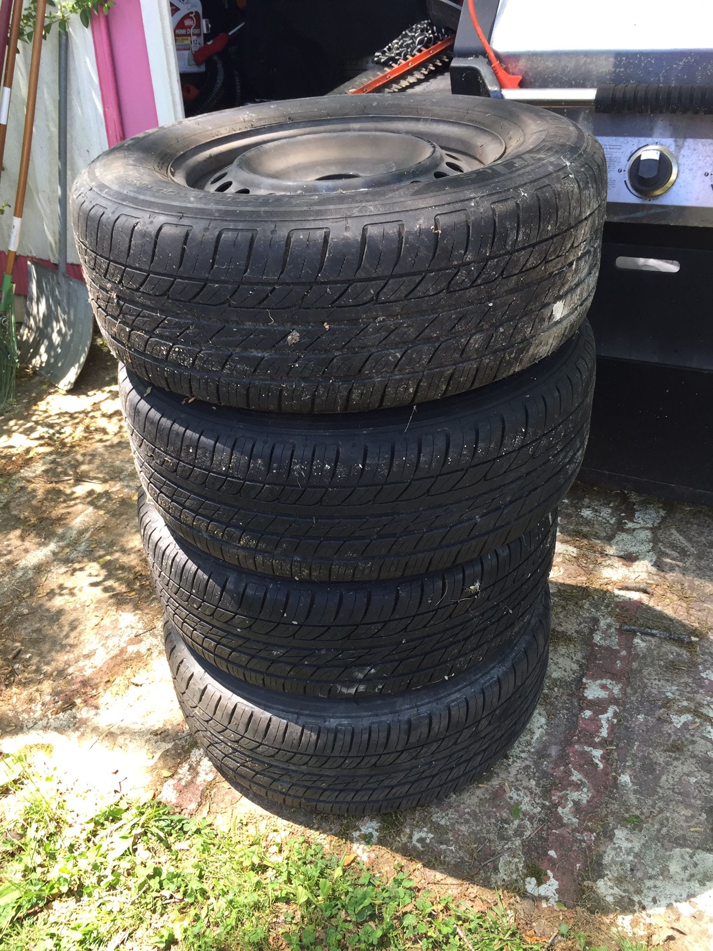 4 tires w/rims in good condition Size; 235/65R16 103T