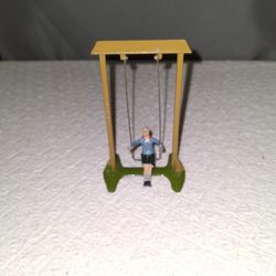 Antique Boy On A Swing