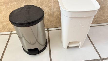 Two trash cans; clean and in good condition.