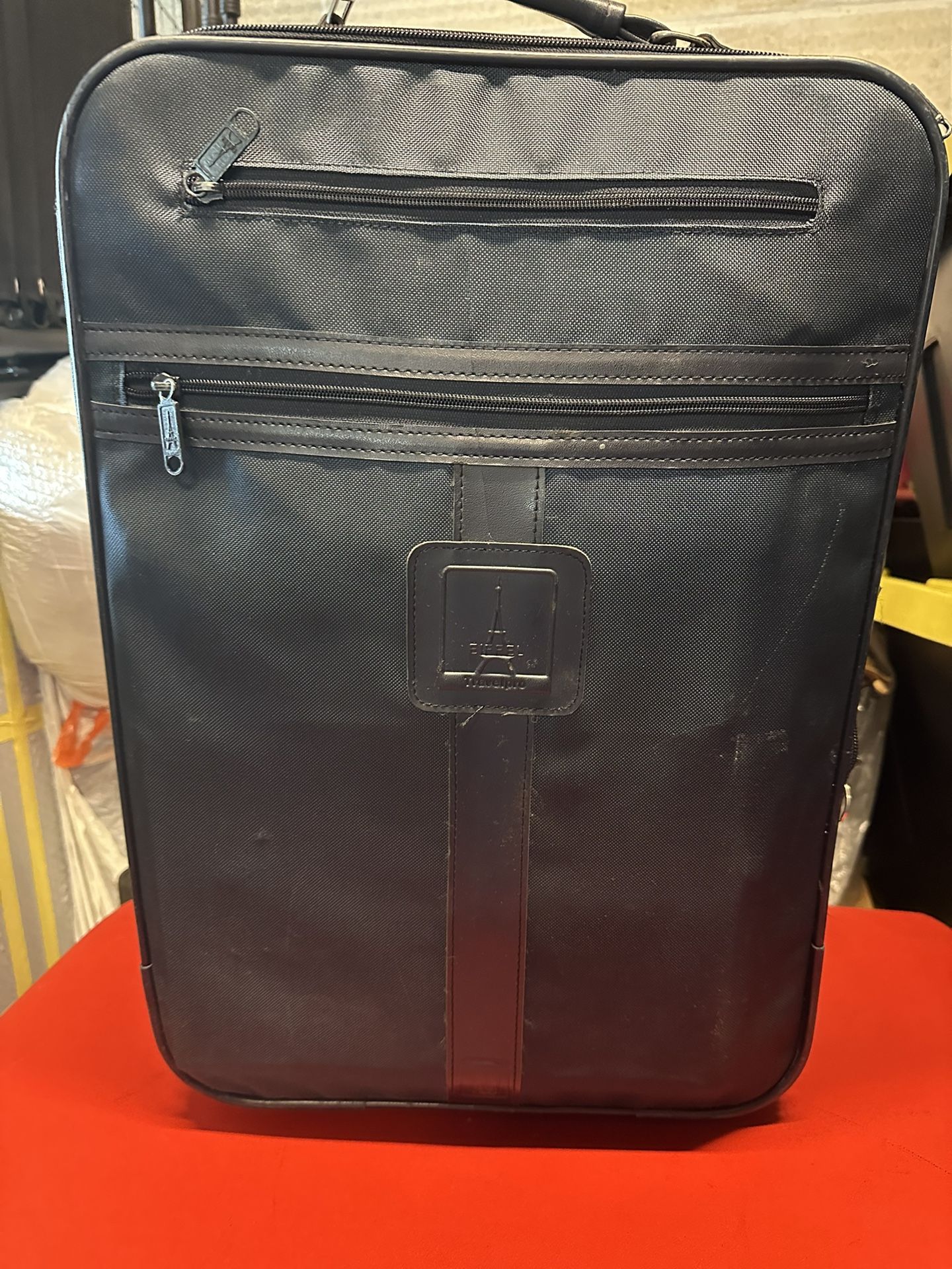 Green luggage with wheels