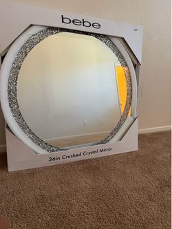 Round crushed crystal mirror.