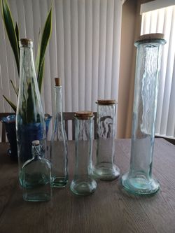 7 decorative glass canisters with lids