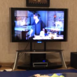 Sleek TV Stand With Two Black Glass Shelves