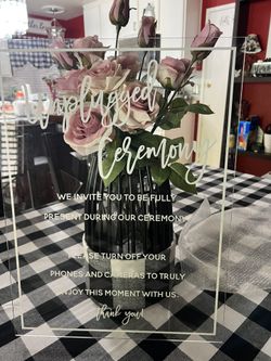 Made of plexiglas with white writing. 15x20