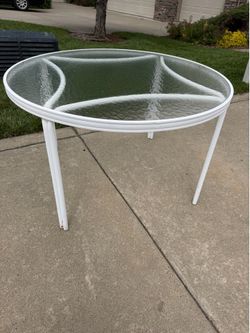 2 great condition round outdoor patio tables $50 each