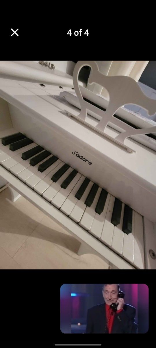 small toy piano with its bench for child