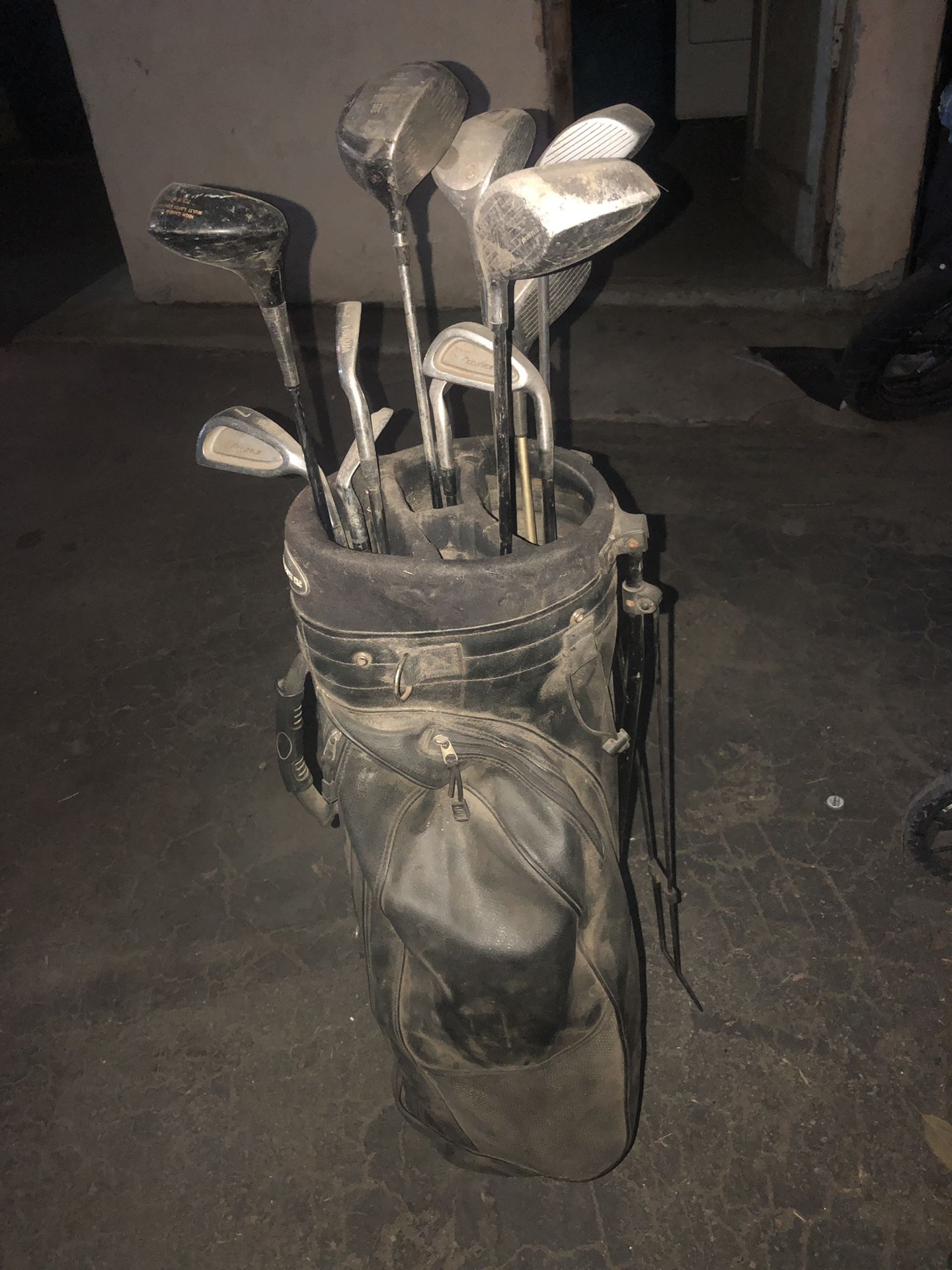 Used golf bag and clubs.