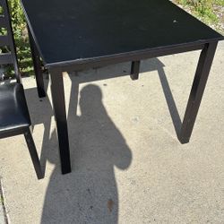 Table And Three Chairs