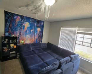 Dark blue sectional sofa bed & mattress topper