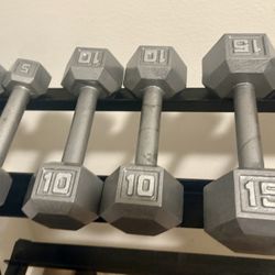 Set Of Cast Iron Hex Dumbbells From 5 To 25 Pounds.