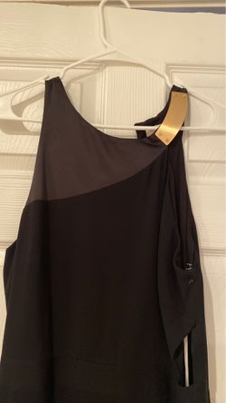 Black halston Formal dress open back tall split cut out around the rim with satin by the neck and a beautiful gold bar by the Collarbone