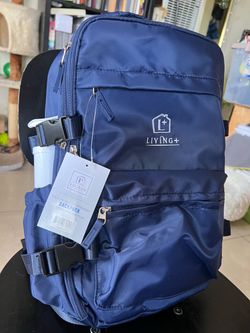Brand New blue Living+ vacuum-seal compression backpack