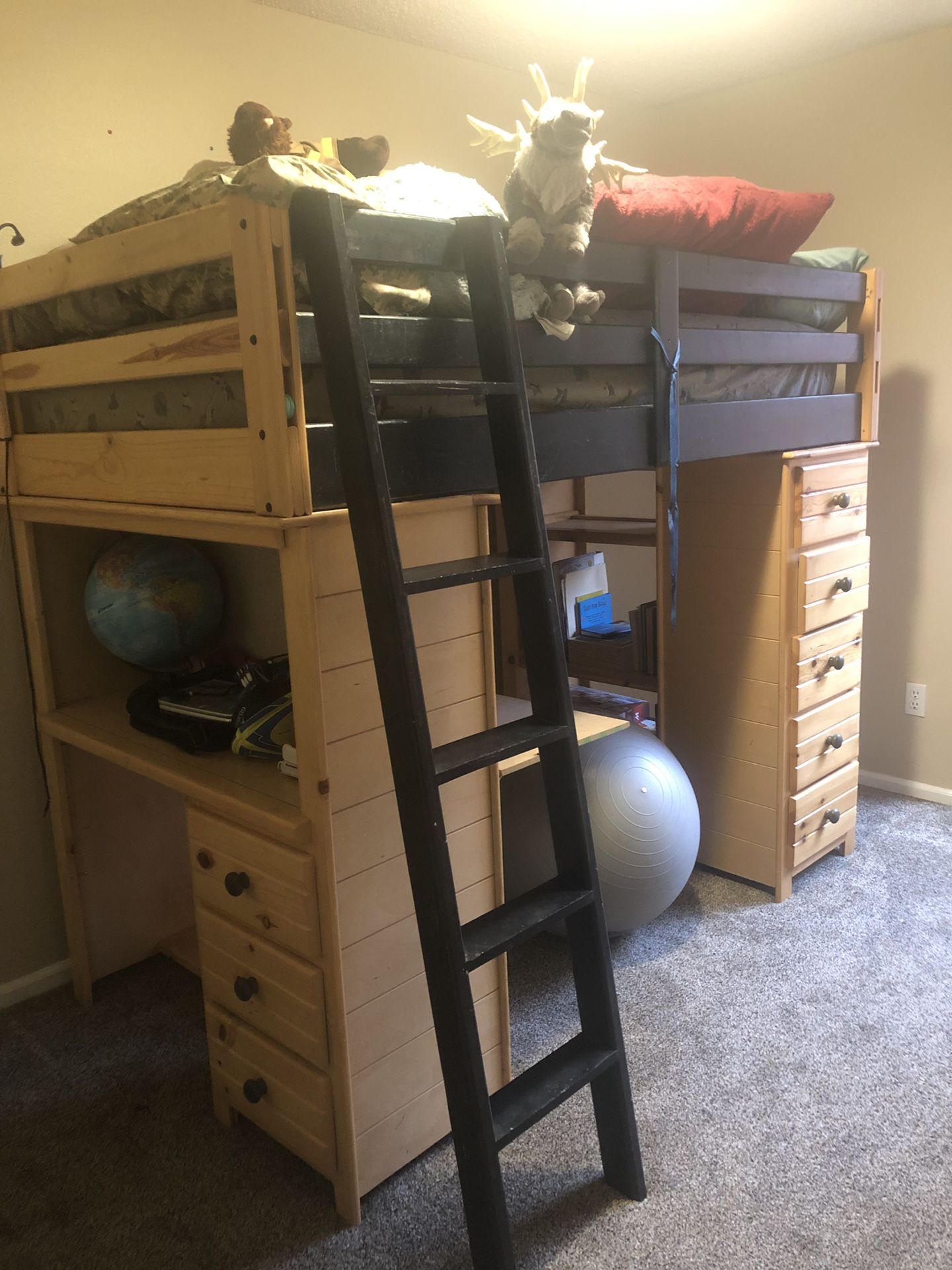 Bunk bed with desk, drawers and trundle.