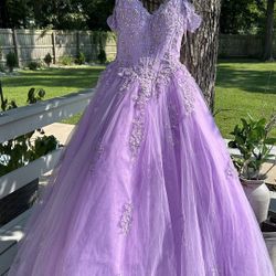 Quincanéra dress from Atianas’s Boutique ( WORN ONCE )