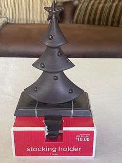 Dark metal Christmas tree stocking holder in its original box.