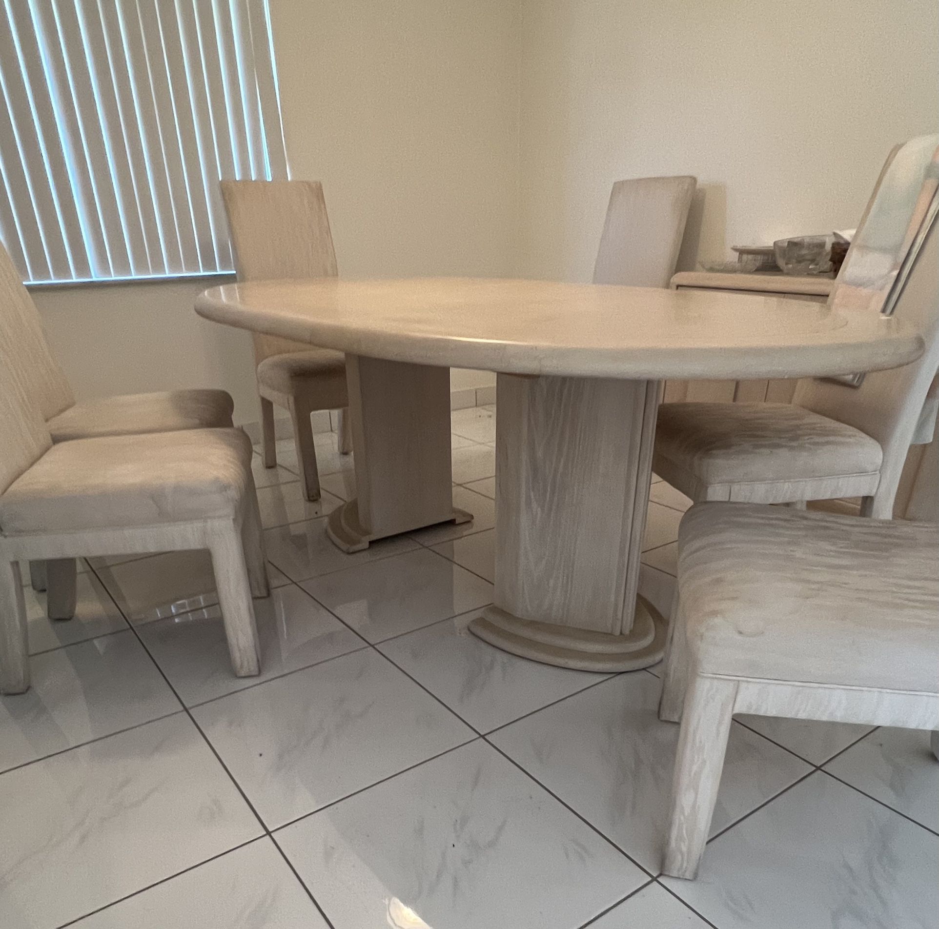 Wooden dining room table and 6 chairs.