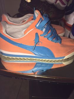 Orange and blue pumas size 7