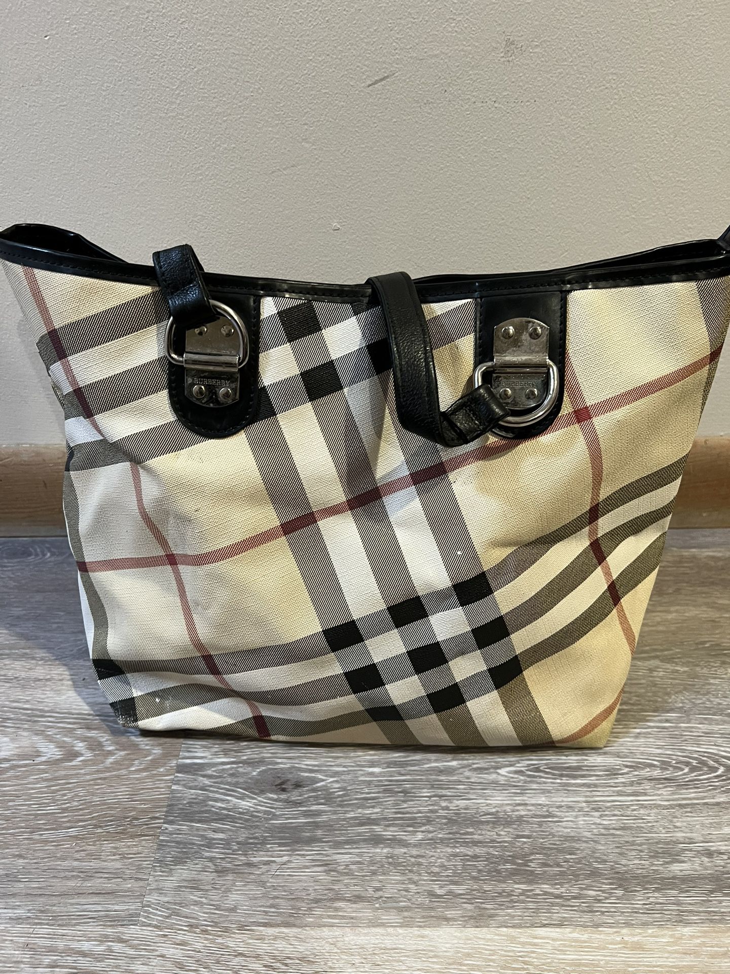 Preowned Burberry hand bag with restored leather handles. Best offer negotiable