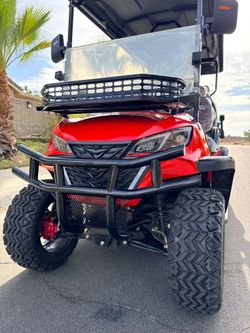 Red Lifted Golf Cart with Off-Road Tires