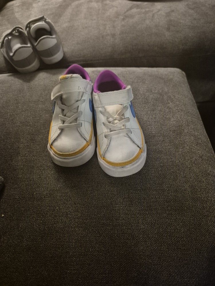 Pair Of Adidas And Nike Kid Shoes