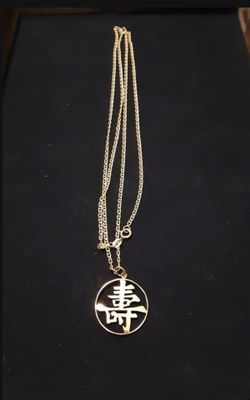 14KT GOLD 24" CHAIN AND 14KT GOLD ASIAN CHARM