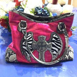 Pink Purse Gently Used. Lots of Pockets. Also Has A Gun Pocket In Back