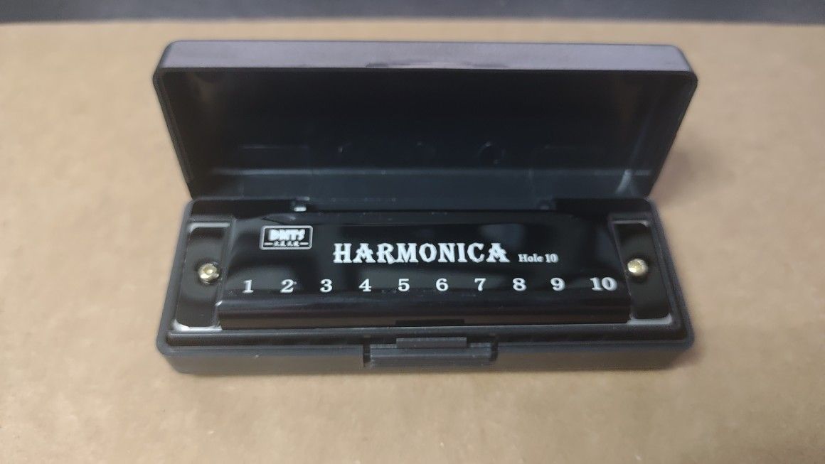 Harmonica New In A Box.
