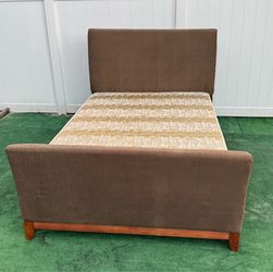 Beautiful Queen bed upholstered in brown velvet with a contemporary design of curved headboard and footboard with mattress and Boxspring included can 
