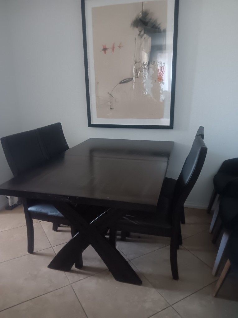 Beautiful Dark Brown Wooden Table With Four Chairs That Can Extend 