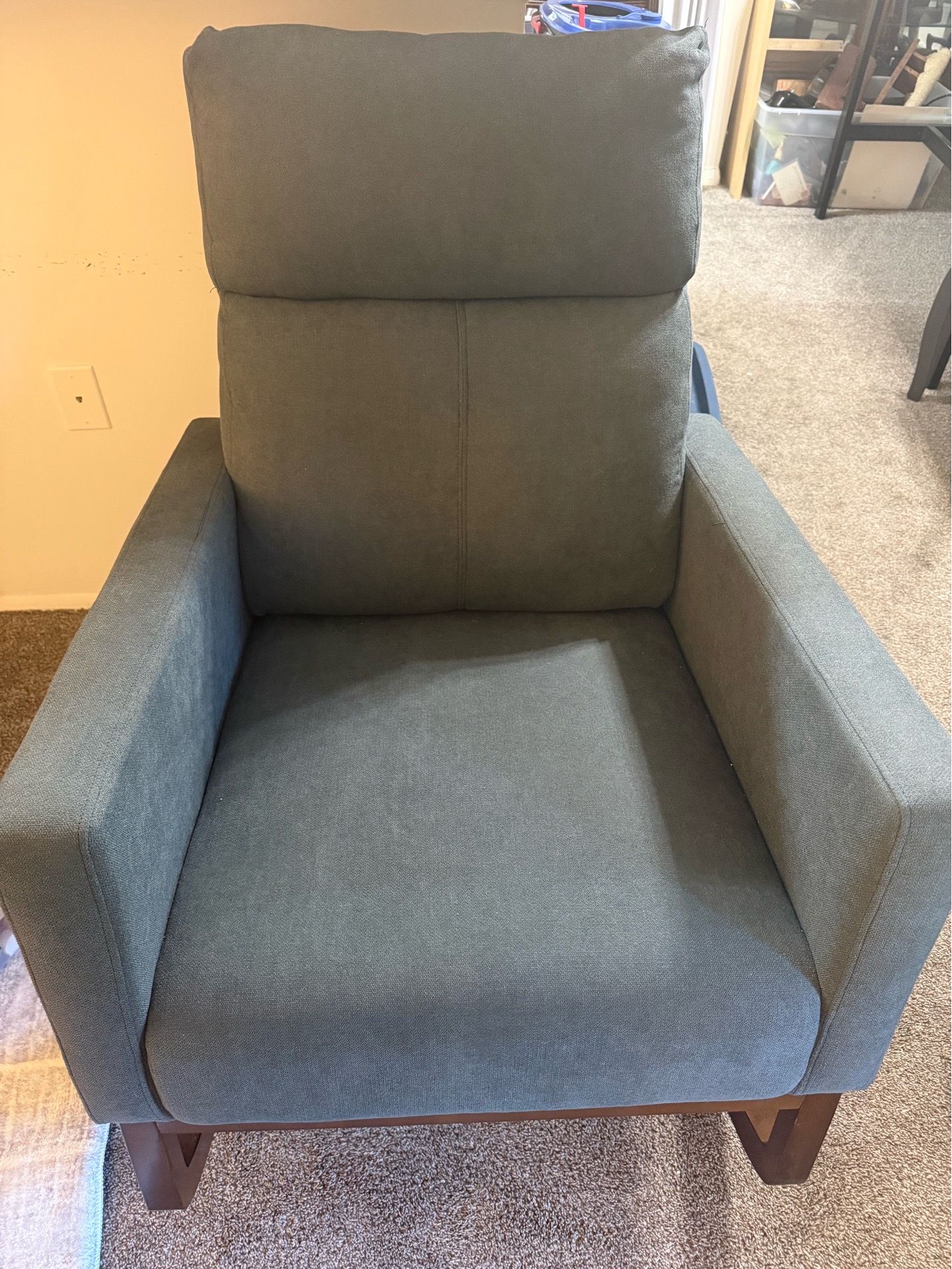 Grey Rocking Chair with two side pockets.