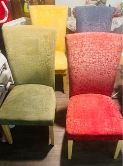 A Set of 4 Colored Upholstery Dining chairs.