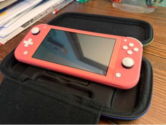 Pink Switch Lite w/ Case, Charger, and 4 Games