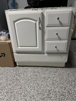 Bathroom sink and cabinet