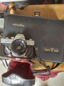 Vintage minolta srt 101 camera in box with paperwork