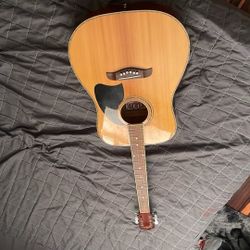 A Oscar Schmidt Six String Guitar