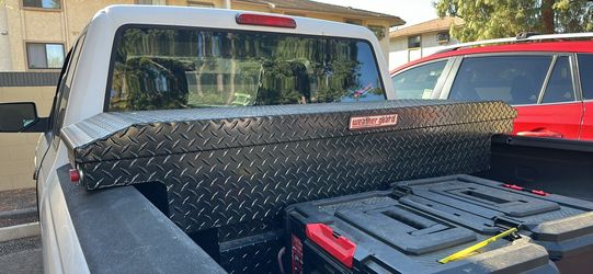Black metal tool box for truck bed