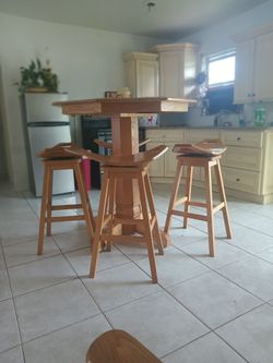 Oak round table with 4 saddle swivel stools sold oak