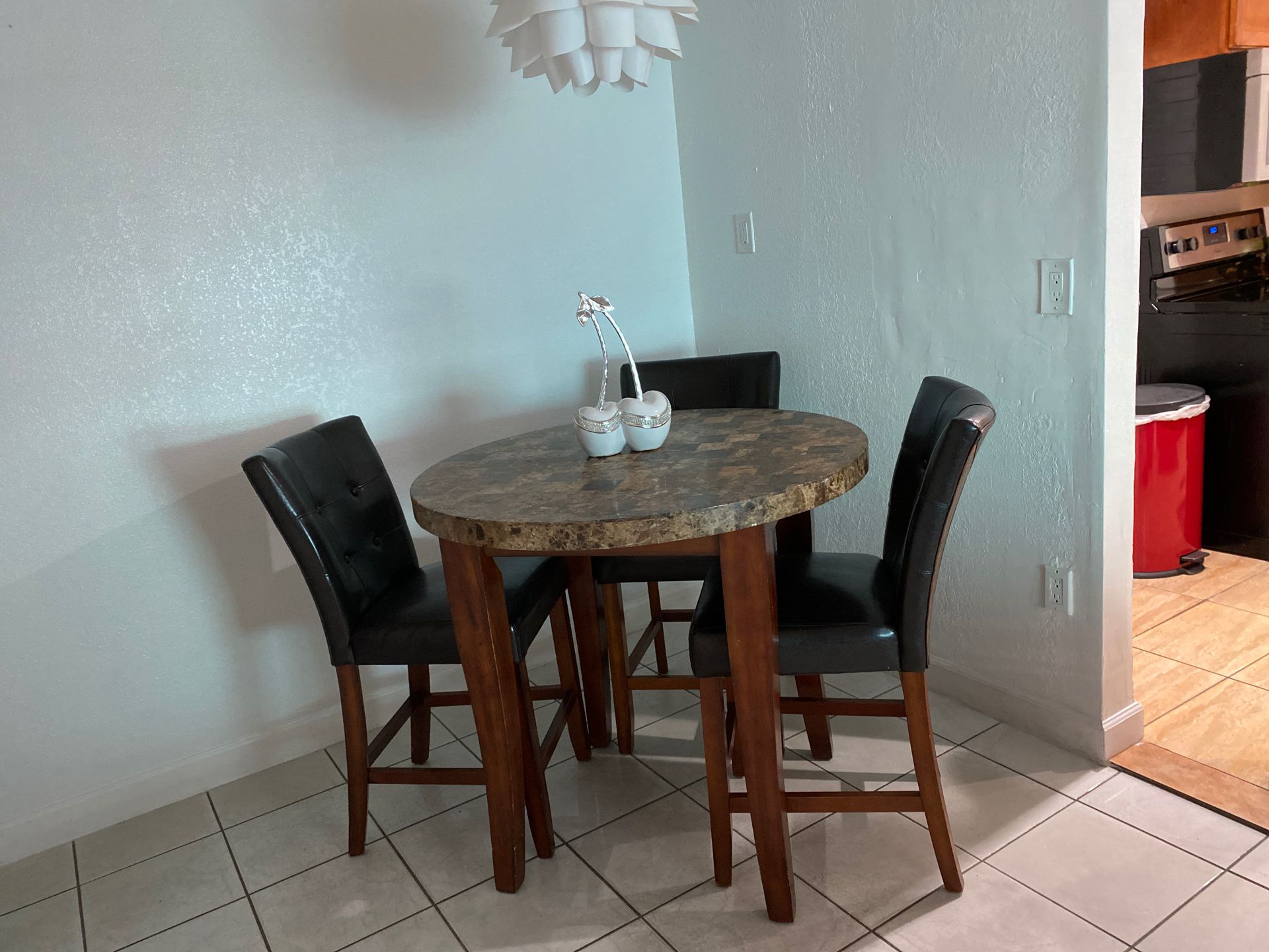 Marble top kitchen table with three chairs
